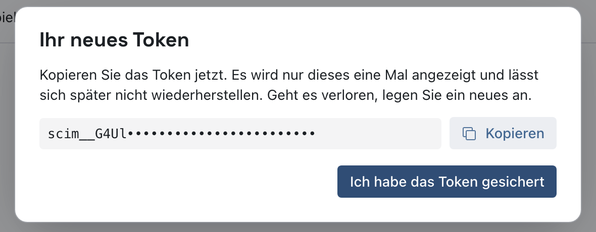 Dialog Ihr neues Token mit dem Hinweis, dass das Token nur einmal angezeigt wird, dem für dieses Bild verdeckten Token, Kopieren und Ich habe das Token gesichert